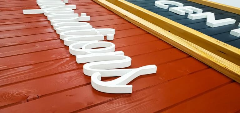 Dimensional letters on board - advance signs and awnings
